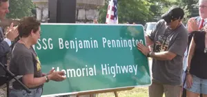Highway memorial sign dedicated to fallen soldier 