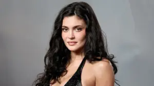 Kylie Jenner poses soaking wet in black bikini for steamy makeup promotional shoot