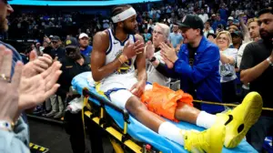 Warriors' Moses Moody leaves game on stretcher after suffering gruesome injury on dunk attempt