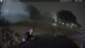 Heart-stopping video shows officers use unlikely tool to save family trapped in floodwaters