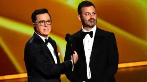 Stephen Colbert emerges from cancellation to urge Emmy voters to select Jimmy Kimmel over own show