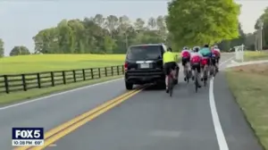 WATCH: Driver smirks in mugshot after allegedly hitting group of cyclists in caught-on-camera road rage