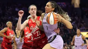 Caitlin Clark breaks WNBA assists record to a chorus of boos as Valkyries spoil the milestone