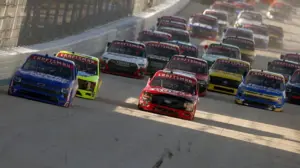 NASCAR tire carrier saves reporter from runaway pit box before Craftsman Truck Series race