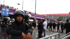 Anti-government protesters clash with riot police outside World Cup opener while Shakira performs inside
